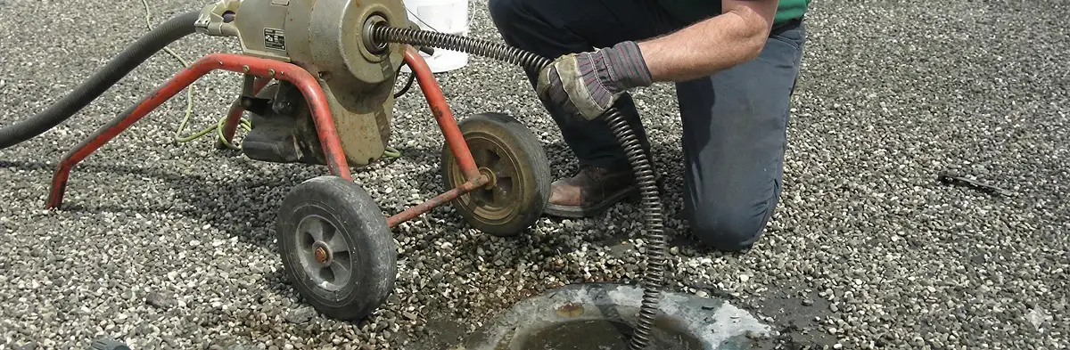 sewer rodding technician actively removing blockages from a sewer line in Buffalo, NY