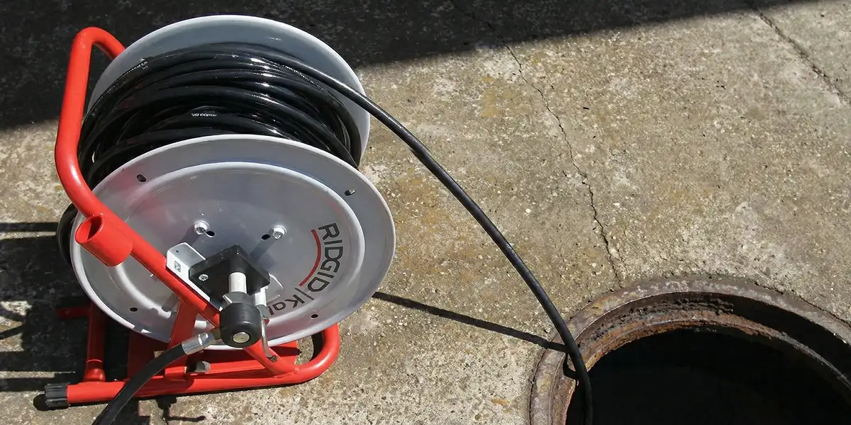sewer rodding equipment prepared to clear clogged sewer lines in Buffalo, NY