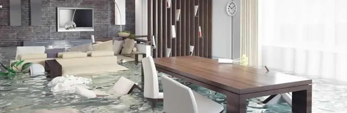 home interior affected by water damage with flooded floors and displaced furniture in Buffalo, NY